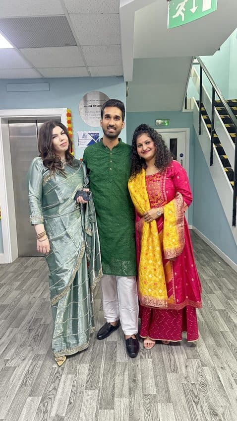 Students posing together in traditional dress at WIC's Diwali celebration