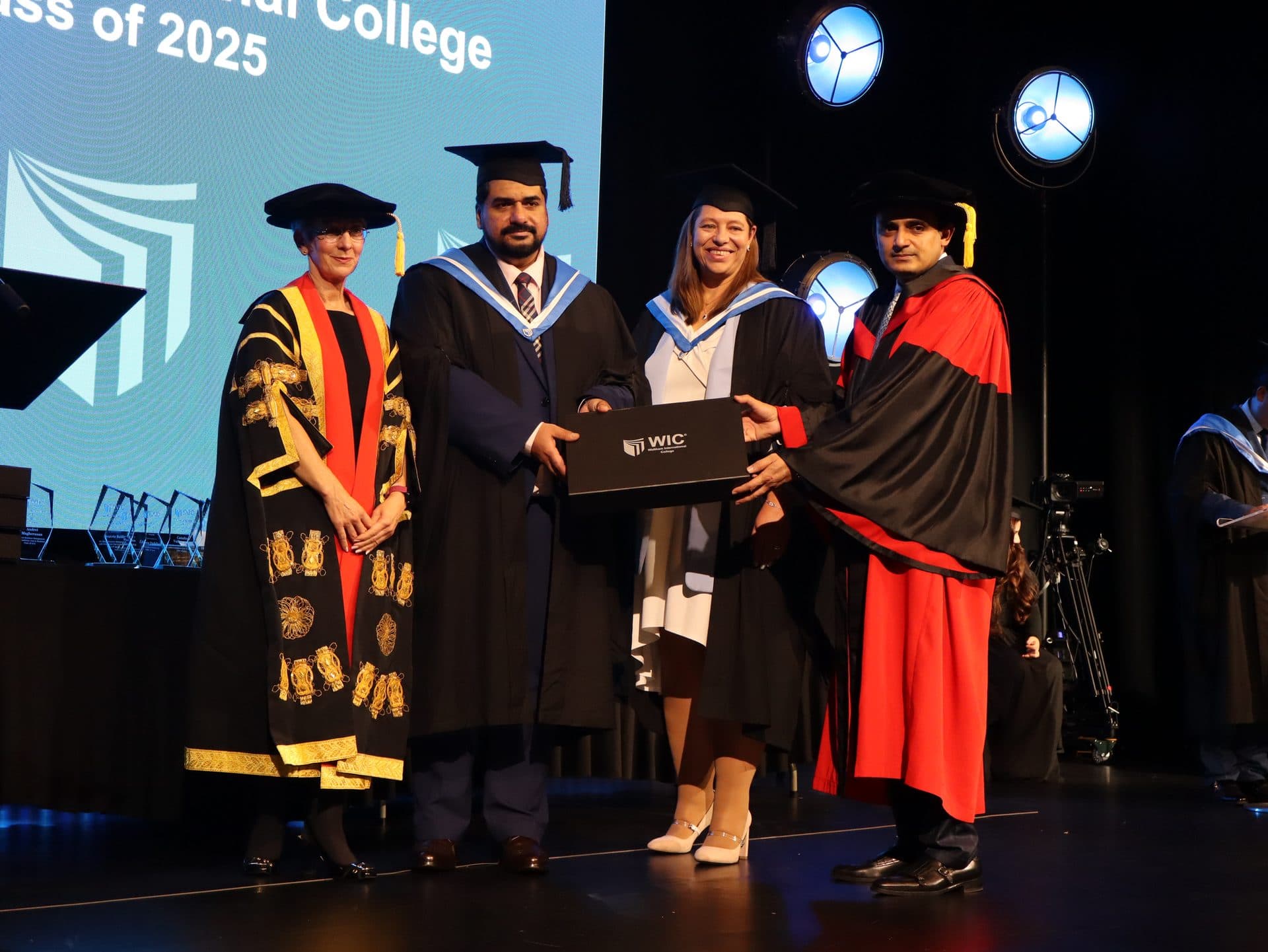 A WIC graduation award presentation on stage