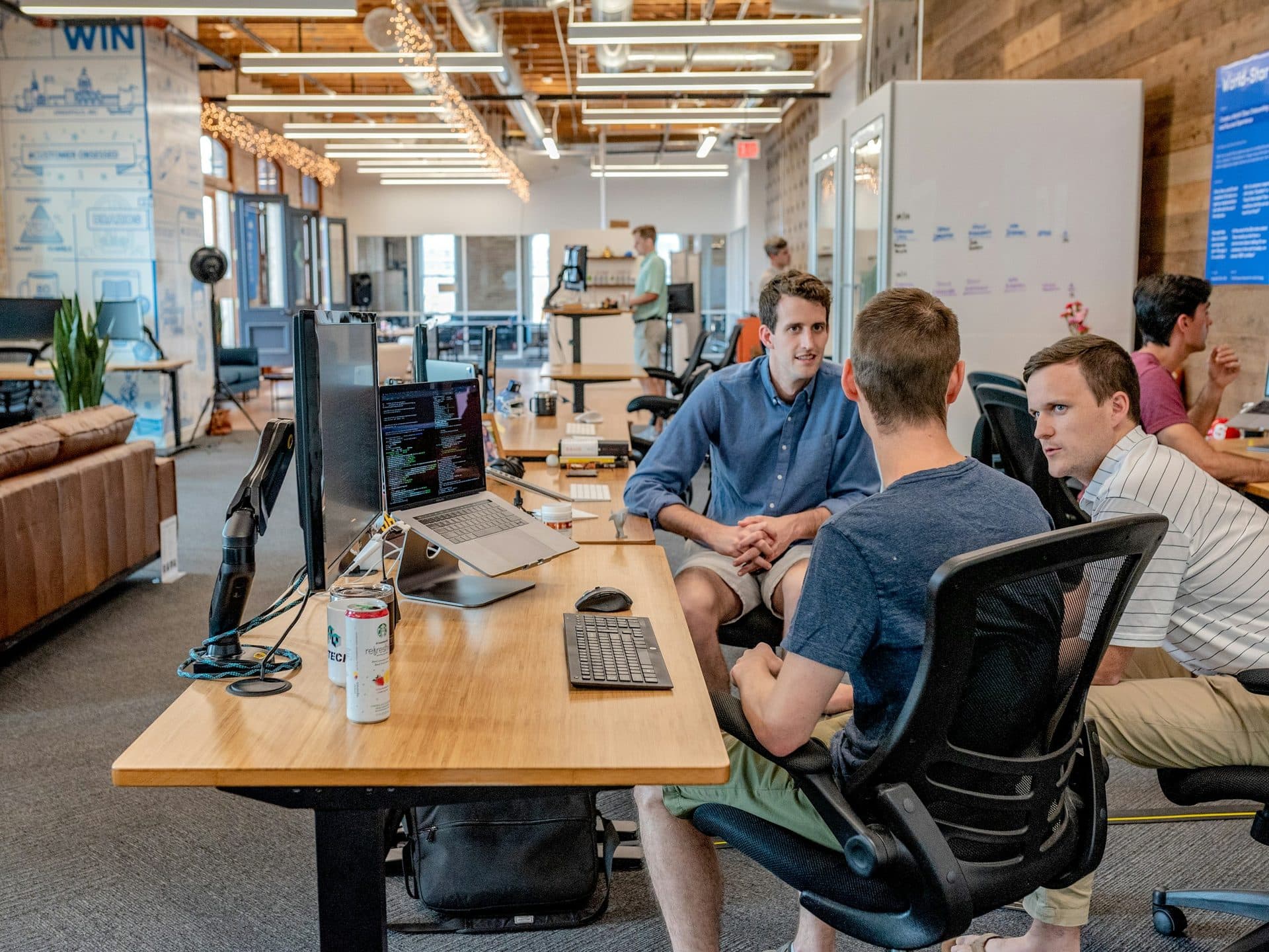 A team collaborating around a desk in a modern office