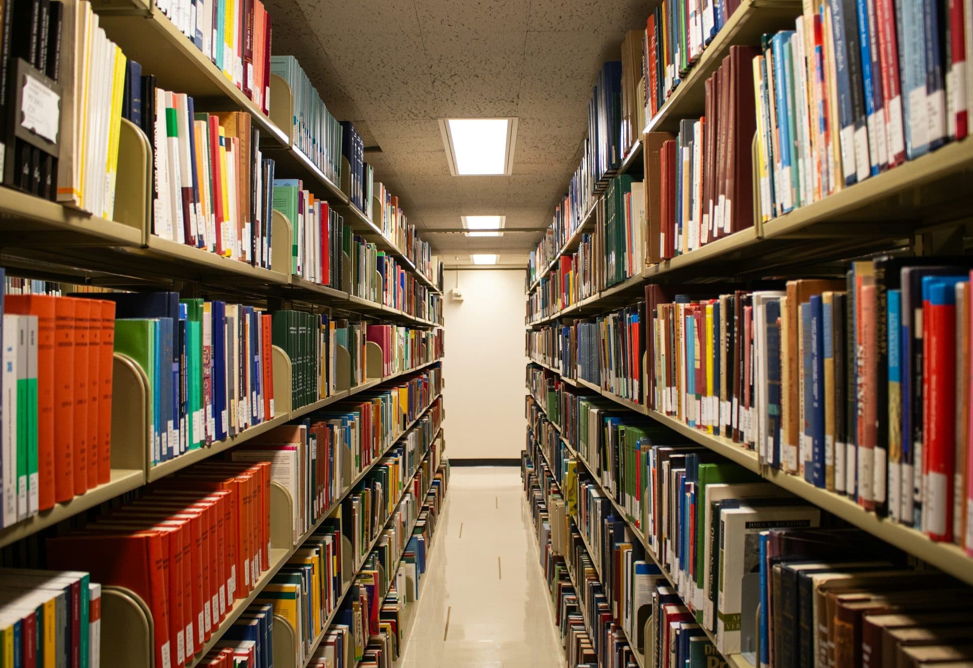 A library aisle lined with academic books